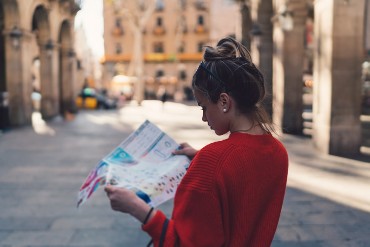 Photo of woman looking at map